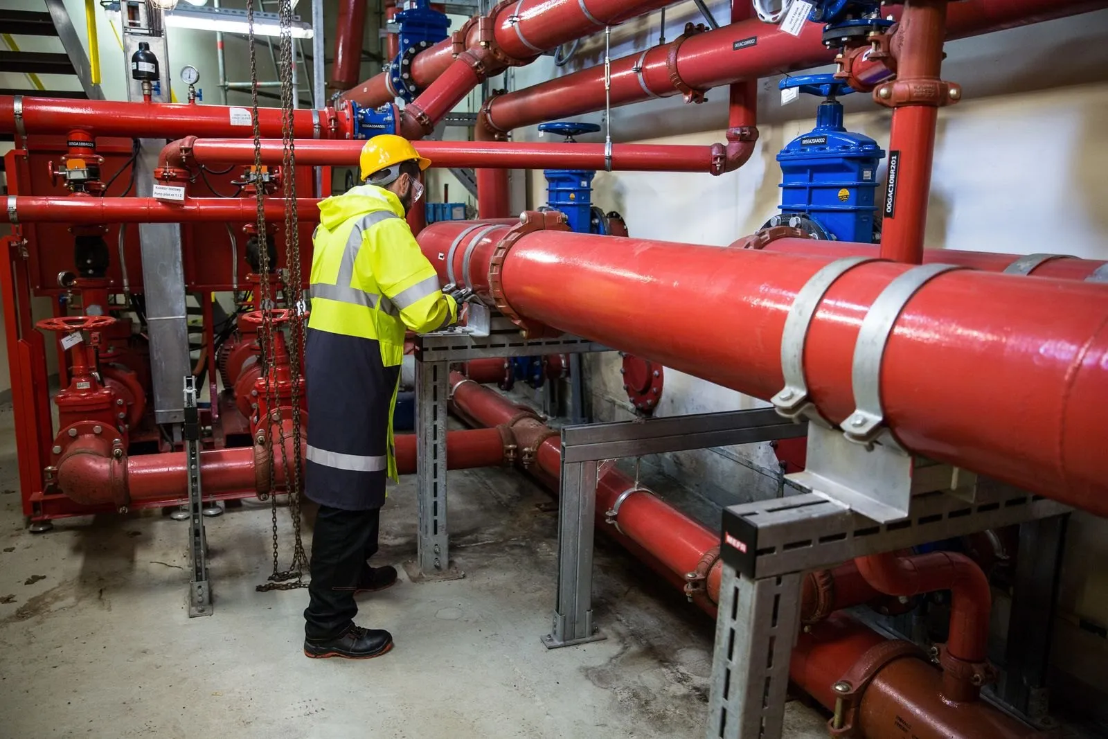 Engineer inspecting industrial piping
