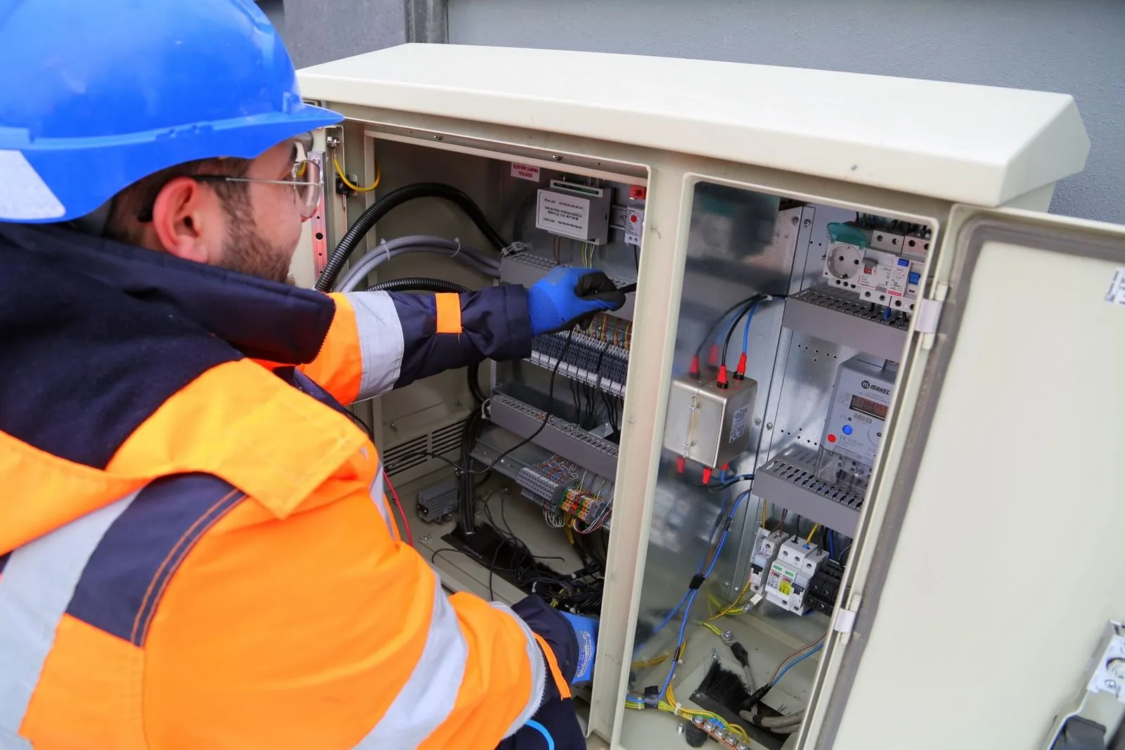 Engineer testing an electrical cabinet